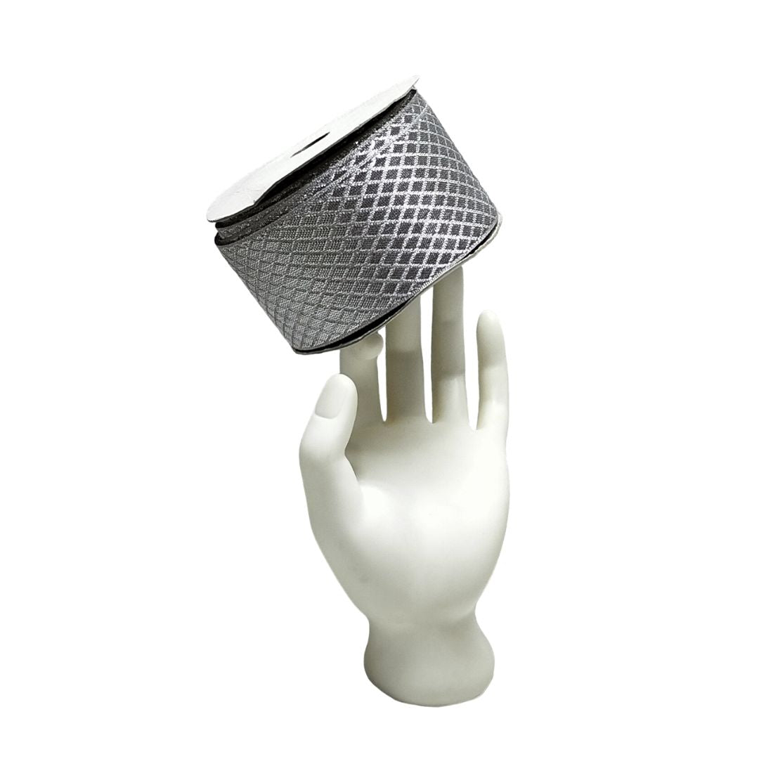 Silver mesh headband on a white mannequin hand against a white background